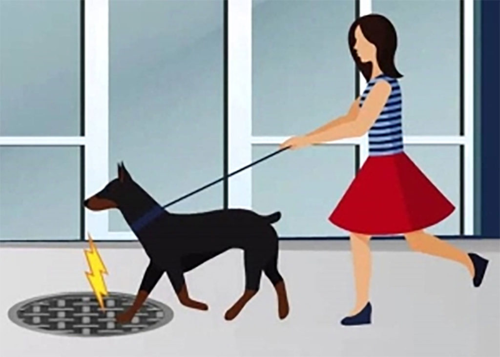 Metal manhole covers pose electrocution risk!